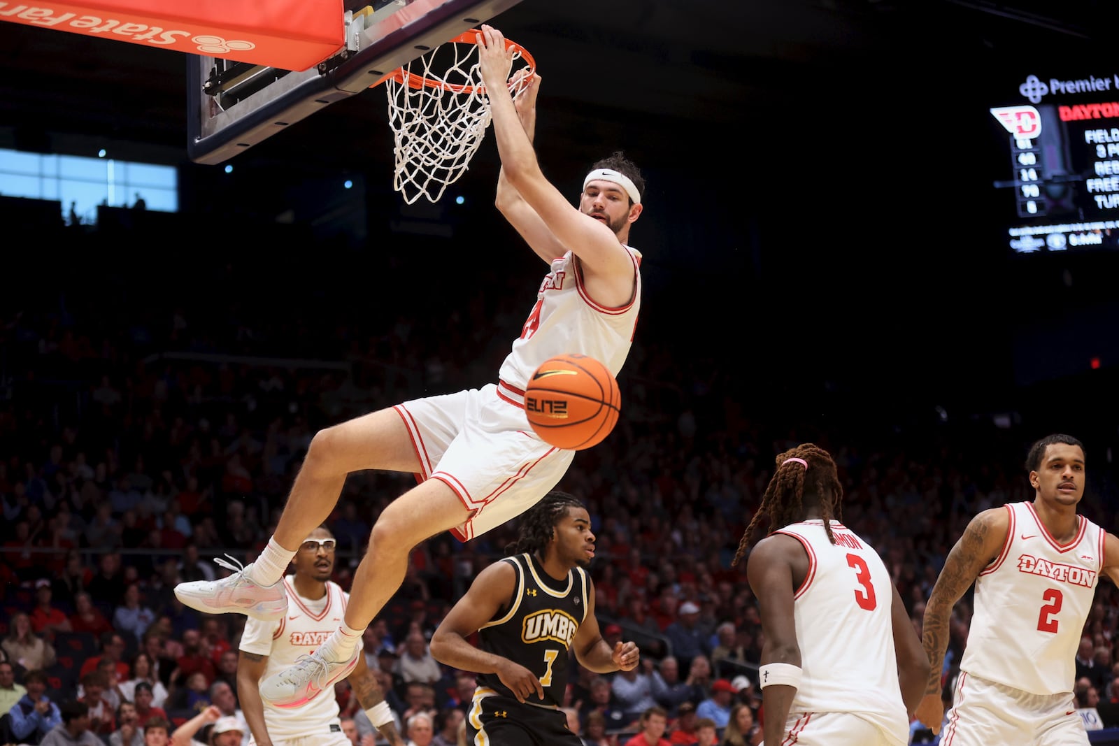 Dayton's Jacob Conner dunks in the first half against Maryland, Baltimore County on Saturday, Nov. 8, 2025, at UD Arena. David Jablonski/Staff