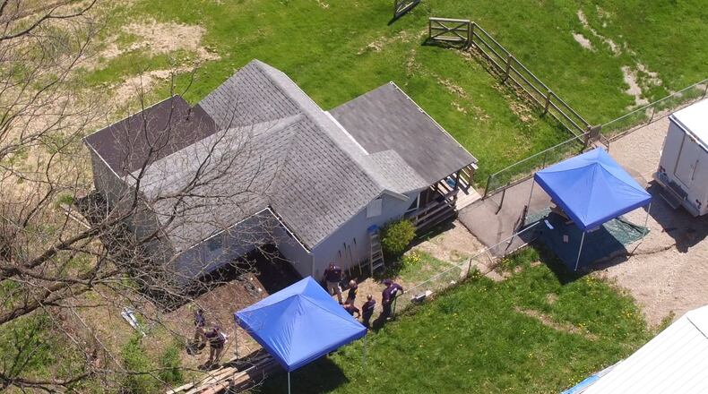 Police, FBI and BCI agents were in Miamisburg on Tuesday morning looking for answers into the disappearance of a woman reported missing last year. Investigators were in the 500 block of Lower Miamisburg Road looking for evidence pertaining to Chelsey Coe’s whereabouts, according to Miamisburg police. Investigators were digging behind this house on the property. TY GREENLEES / STAFF