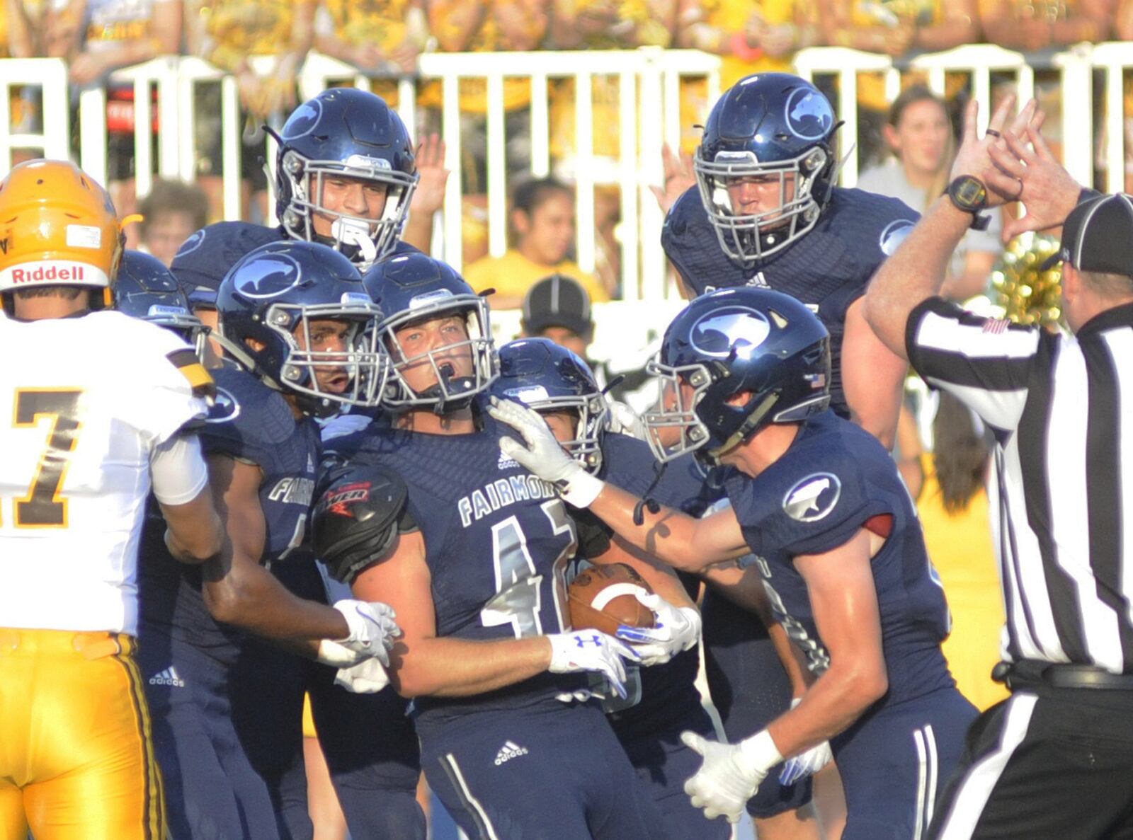 Fairmont’s Trey Baker (with ball) is congratulated by teammates after a first-half interception. Fairmont defeated visiting Alter 12-6 in a Week 1 high school football opener on Thu., Aug. 23, 2018. MARC PENDLETON / STAFF