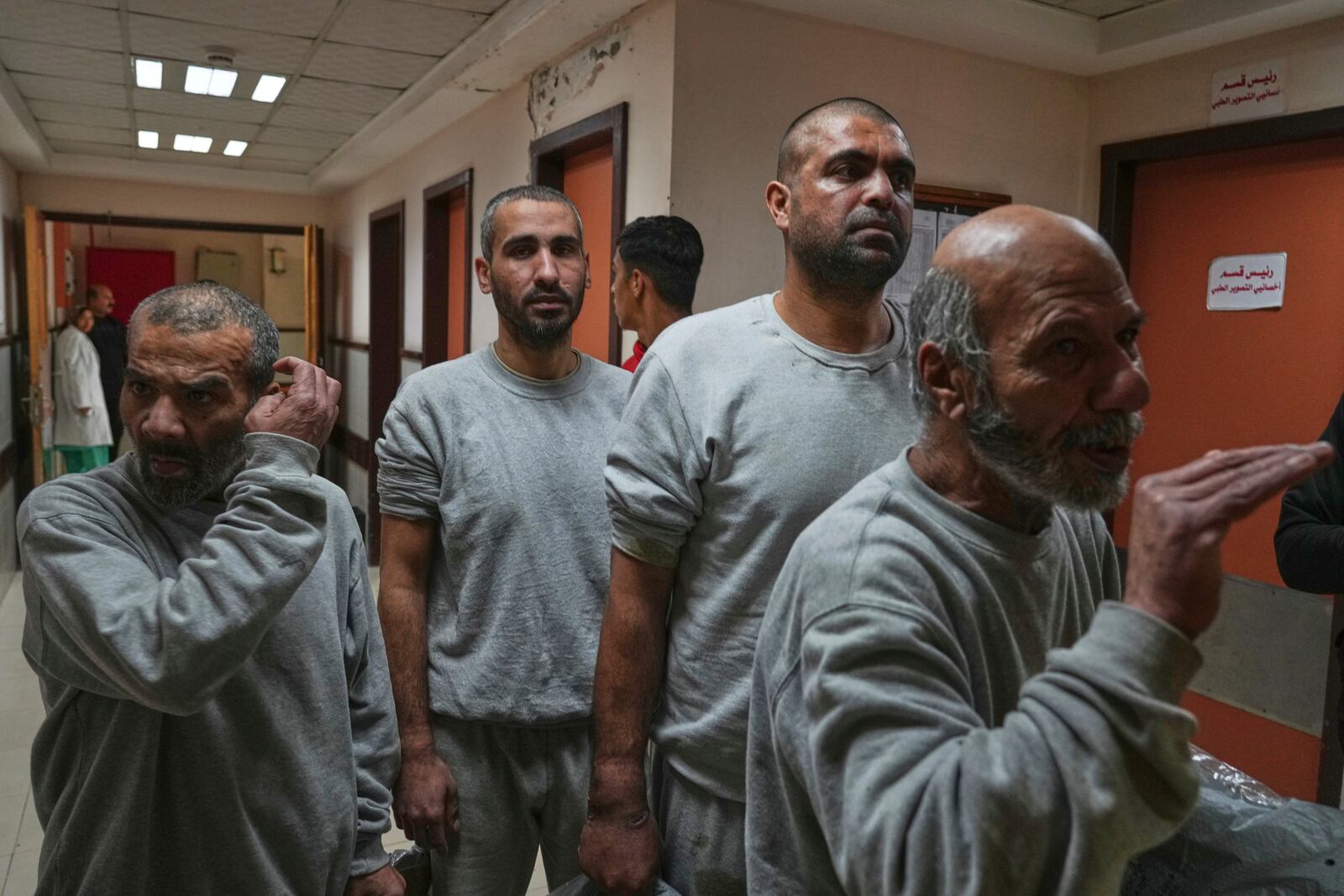 Freed Palestinian prisoners upon arrival at al-Aqsa Hospital in Deir al-Balah, central Gaza Strip, after being released from an Israeli prison, Thursday, April 10, 2025. (AP Photo/Abdel Kareem Hana)