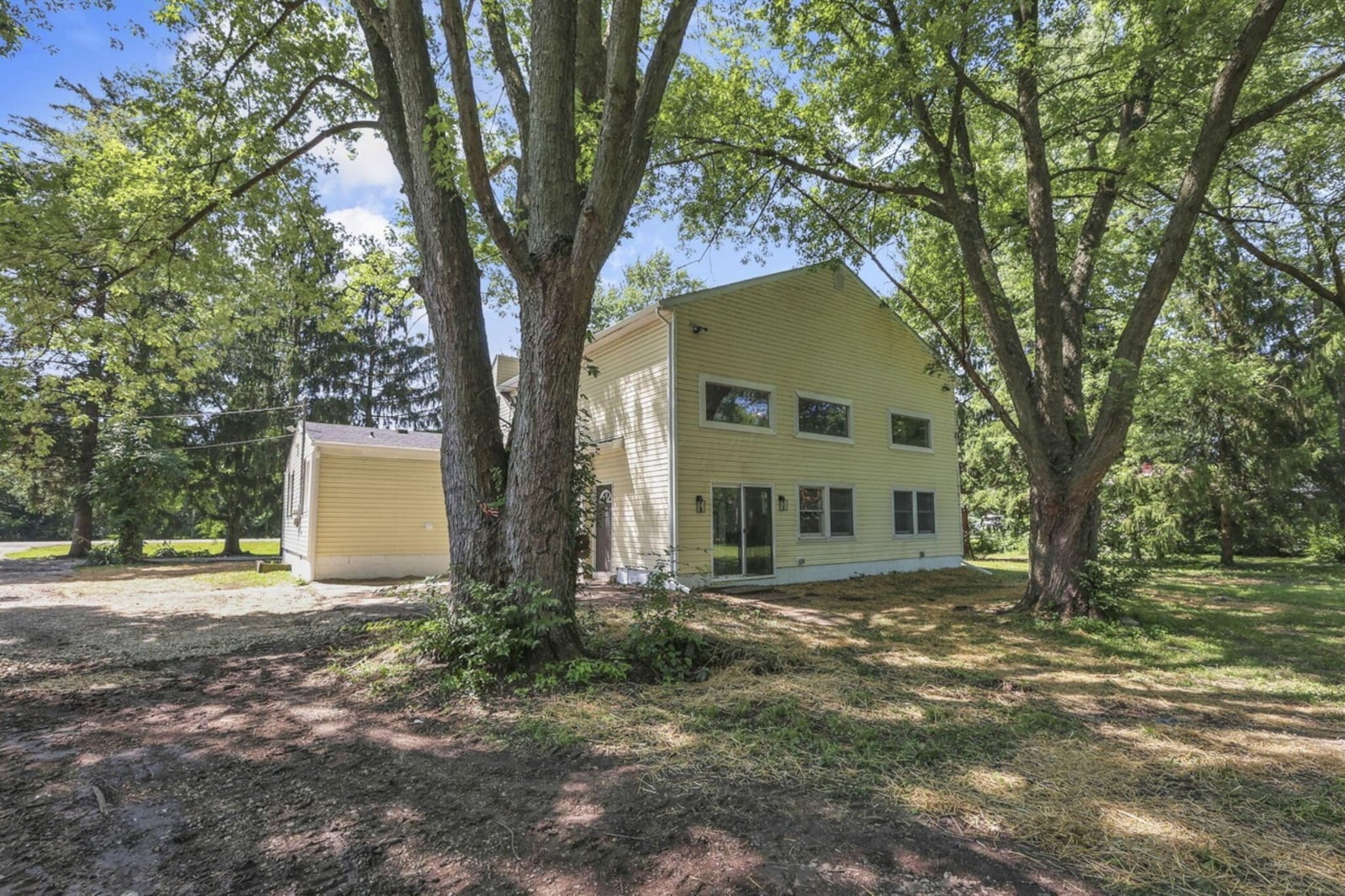 The rear of this newly renovated Springfield Township home is wooded and includes a horse barn that could also be used as a detached garage. Contributed