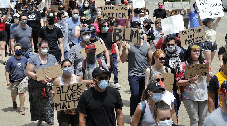 Protesters marched for George Floyd down Main street in Dayton Saturday. MARSHALL GORBYSTAFF