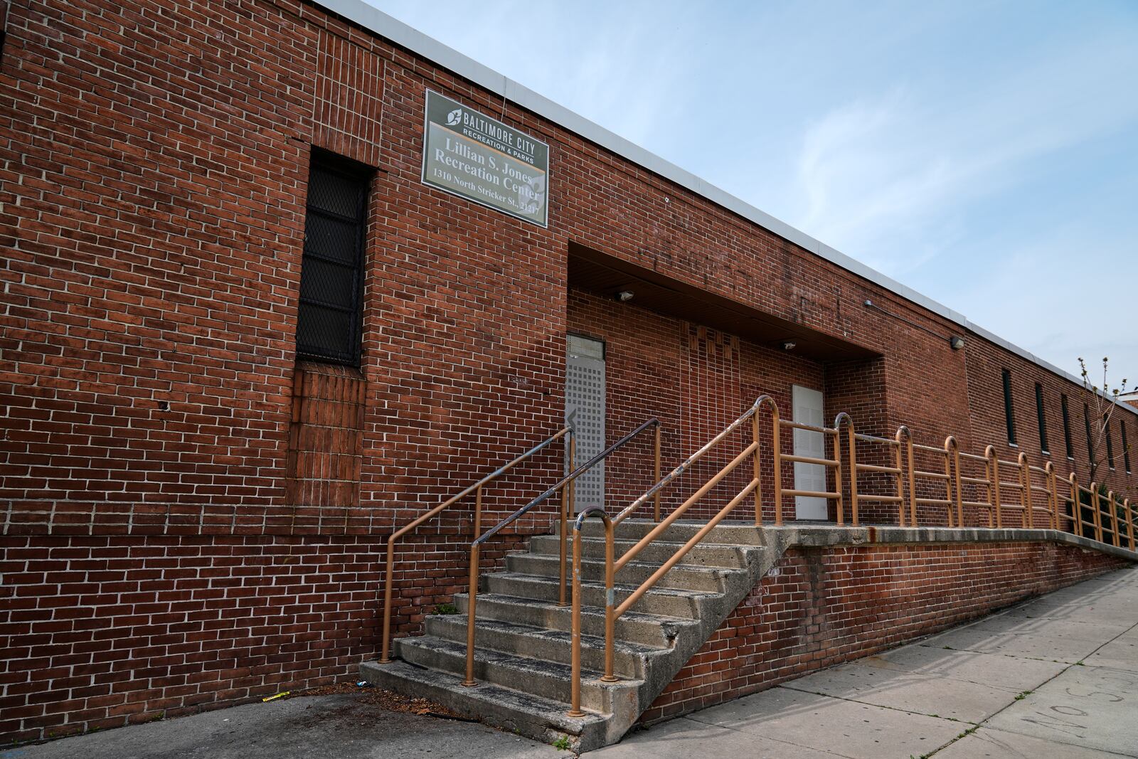 A sign on the Lillian S. Jones Recreation Center remains despite the center being closed since 20121, as seen in the Sandtown-Winchester neighborhood in Baltimore, Monday, April 14, 2025. (AP Photo/Stephanie Scarbrough)