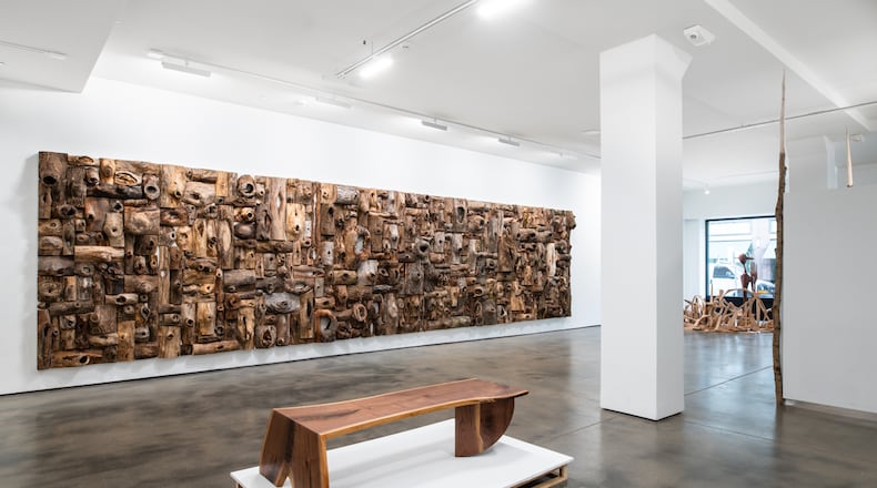 A huge wall of knots and knot holes is installed in the introductory gallery of the exhibit “Shon Walters: The Hole Belly” at The Co in Dayton through Jan. 14. CONTRIBUTED