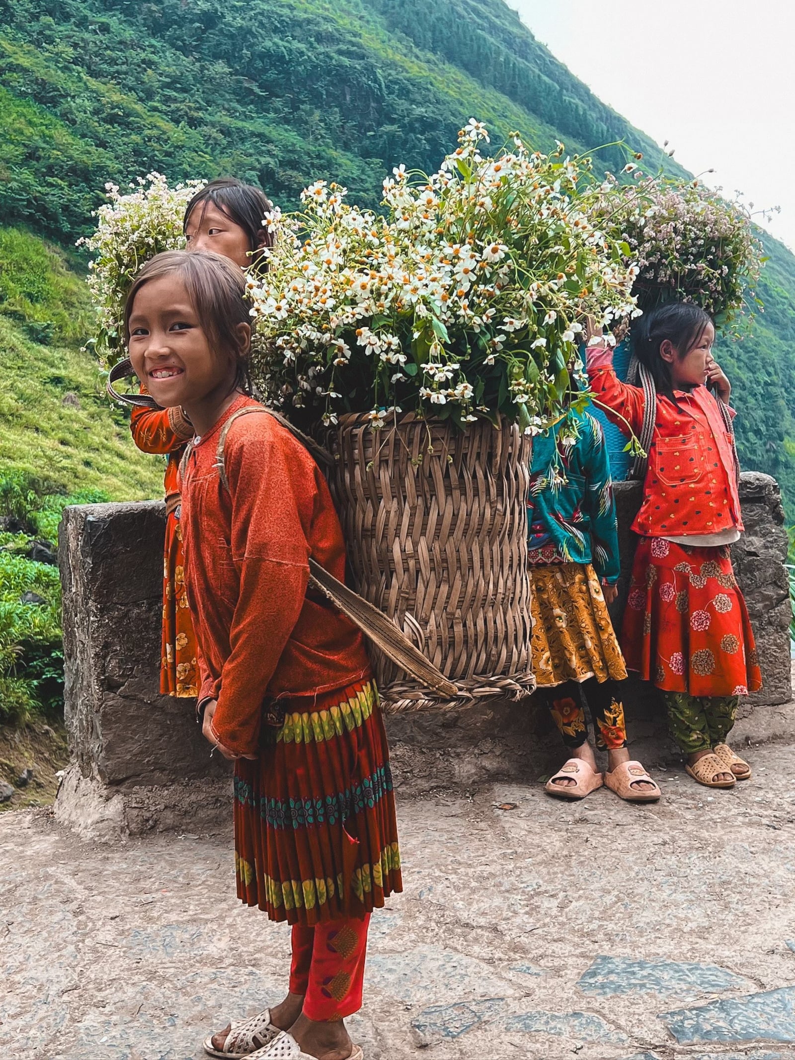 Young girls selling flowers on the Ha’ Giang Loop in Vietnam. Lesli Dean/CONTRIBUTED
