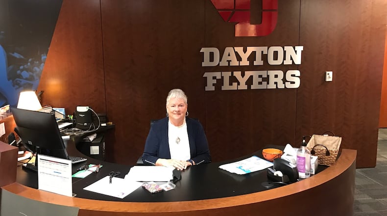 Linda Waltz at the front desk of the Dayton Flyers women’s basketball offices. Tom Archdeacon/STAFF
