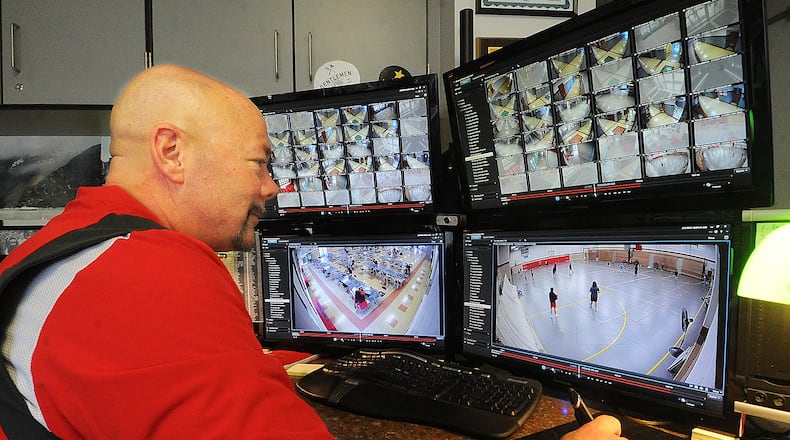 Troy High School Assistant Principal, Jeff Schultz can watch all the security cameras in the high school from his office. Troy is is one of more than a dozen local school districts that will be receiving money as part of a state program to upgrade physical safety and security systems in K-12 schools. MARSHALL GORBY\STAFF
