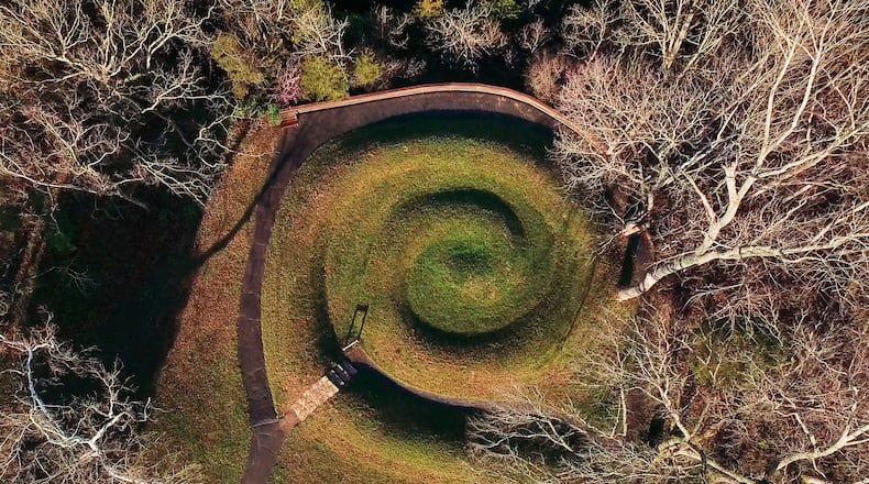 Serpent Mound's coiled tail has alignment with the summer solstice sunset.   Serpent Mound is the largest surviving ancient effigy mound in the world and is on the National Register of Historic Places.  It is located near Peebles, Ohio on State Route 73.    TY GREENLEES / STAFF