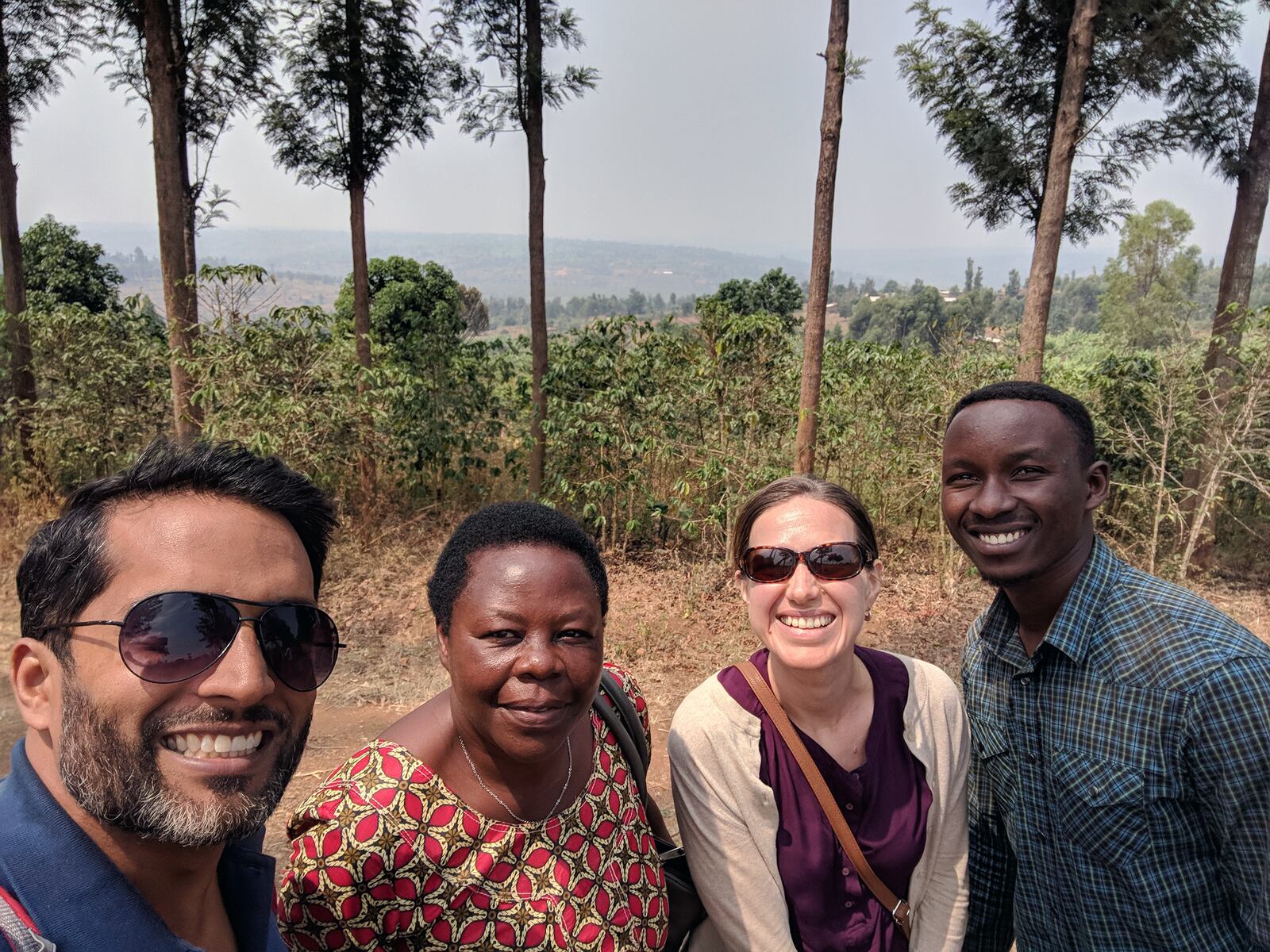 Daniel (left) and Kait (second from right) with the Shining Coffee team in Rwanda. CONTRIBUTED