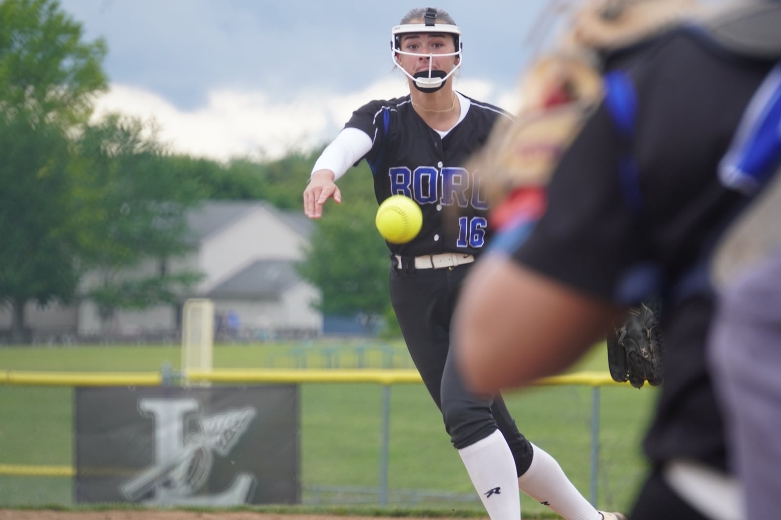 Springboro's Katie Jonas sends a pitch to the plate during her Division I district final against Mason on Thursday at Lebanon. CHRIS VOGT / CONTRIBUTED