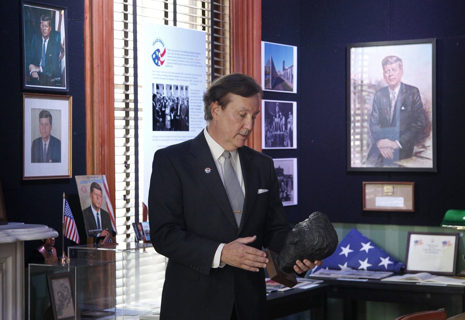Bill White of Dayton has hundreds of Kennedy artifacts he has collected on display in an exhibit called ” Glory and Tragedy: JFK and RFK, 1960-1968 ,” at the Dayton International Peace Museum. LISA POWELL / STAFF