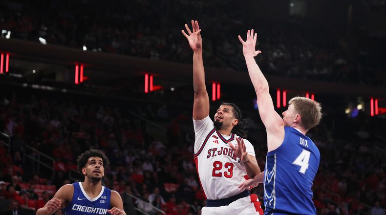 St. John's forward Bryce Hopkins (23) shoots the ball over Creighton guard Josh Dix (4) during the second half of an NCAA college basketball game, Saturday, Feb. 21, 2026, in New York. (AP Photo/Heather Khalifa)