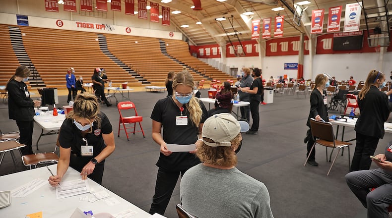 A COVID vaccination clinic was set up in the Pam Evans Smith Arena at Wittenberg University to vaccinate students. BILL LACKEY/STAFF