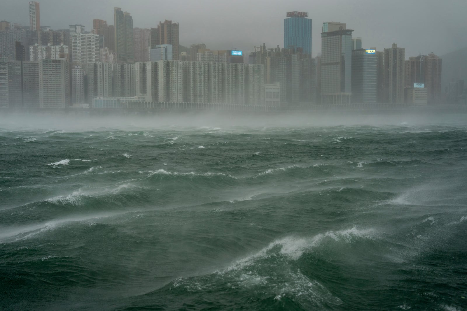 Waves are seen near the Victoria Harbor following the Typhoon Wipha, in Hong Kong, Sunday, July 20, 2025. (AP Photo/Vernon Yuen)