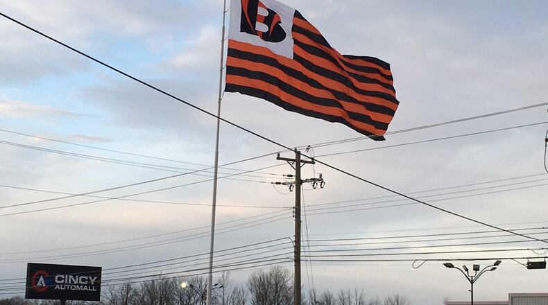 Cincy Auto Mall on Dixie Highway in Fairfield displays an enormous Cincinnati Bengals flag ahead of the team playing in Super Bowl LVI. AMY BURZYNSKI/STAFF