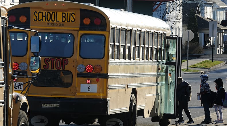 Students boarding the bus Thursday, March 21, 2024 at Broadway Elementary school in Tipp City. MARSHALL GORBY\STAFF