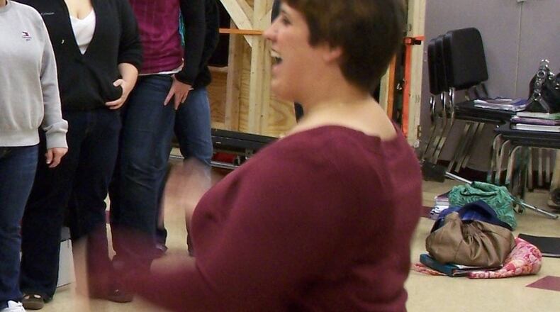 Lebanon High School vocal teacher Kristi Ross (right) conducts rehearsals for the school’s Cantare Choir in this file photo.