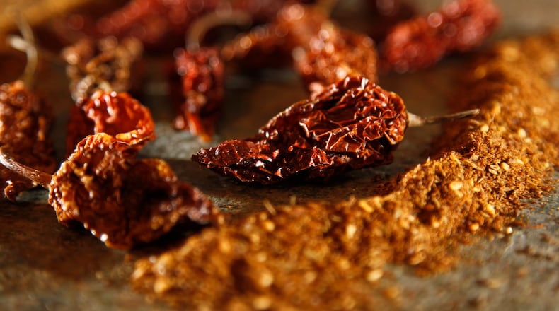 Ghost peppers and za'atar spice blends are two spices that can heat up a recipe.  LISA POWELL / STAFF