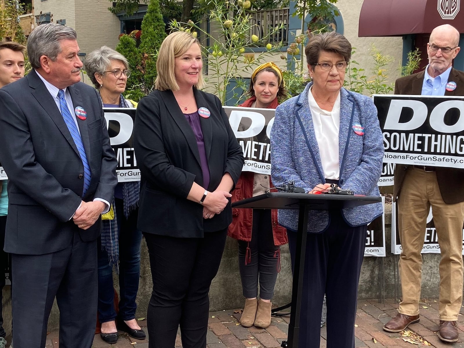 Montgomery County Auditor Karl Keith, left; Dayton Mayor Nan Whaley, center; and state Sen. Peggy Lehner, speak in the Oregon District on Friday at the launch of their “Do Something” campaign. Ismail Turay Jr./Staff