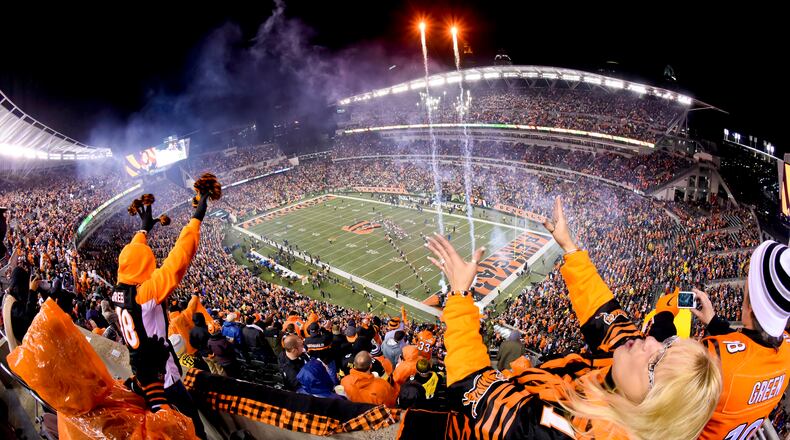 Fans cheer on the Cincinnati Bengals before their 18-16 loss to the Pittsburgh Steelers in the AFC wild card playoff game Saturday, Jan. 9 at Paul Brown Stadium in Cincinnati. NICK GRAHAM/STAFF