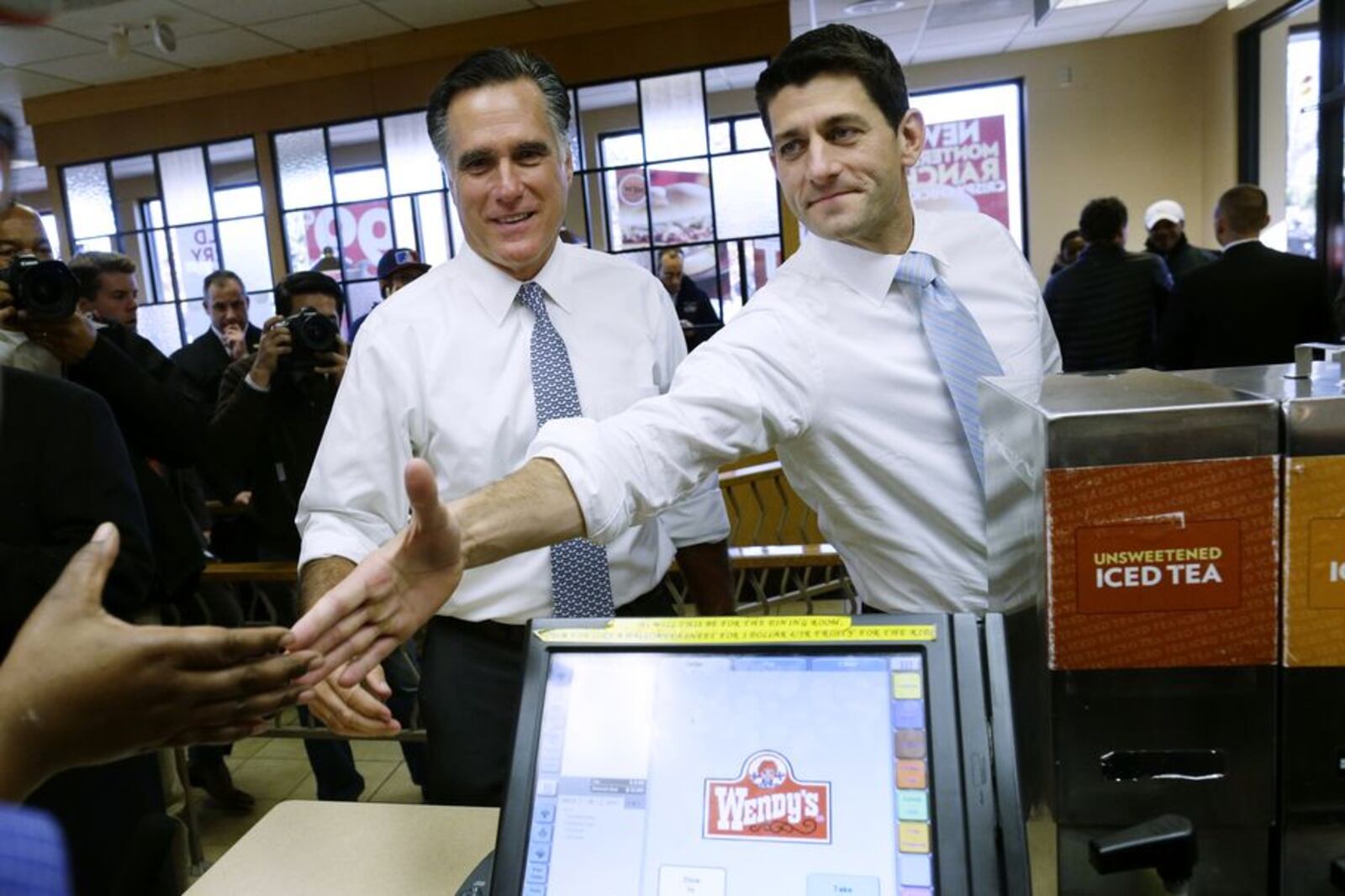 In this Nov. 6, 2012, file photo, then-Republican presidential candidate, former Massachusetts Gov. Mitt Romney and his vice presidential running mate, Rep. Paul Ryan, R-Wis., make an unscheduled stop at a Wendy's restaurant in Richmond Heights, Ohio. Ryan has spent his entire life preparing for a job he says he never wanted. Ryan worked as a congressional intern in college, returning later to work as a paid staffer on Capitol Hill. By 28, he was a member of the House. By his early 40s, he was the chairman of the House Budget Committee and then the powerful tax-writing Ways and Means Committee. In 2012, he was a vice presidential candidate and a talked-about future presidential contender. This week, Ryan is set to become Speaker of the House, second in line to the presidency (AP Photo/Charles Dharapak, File)
