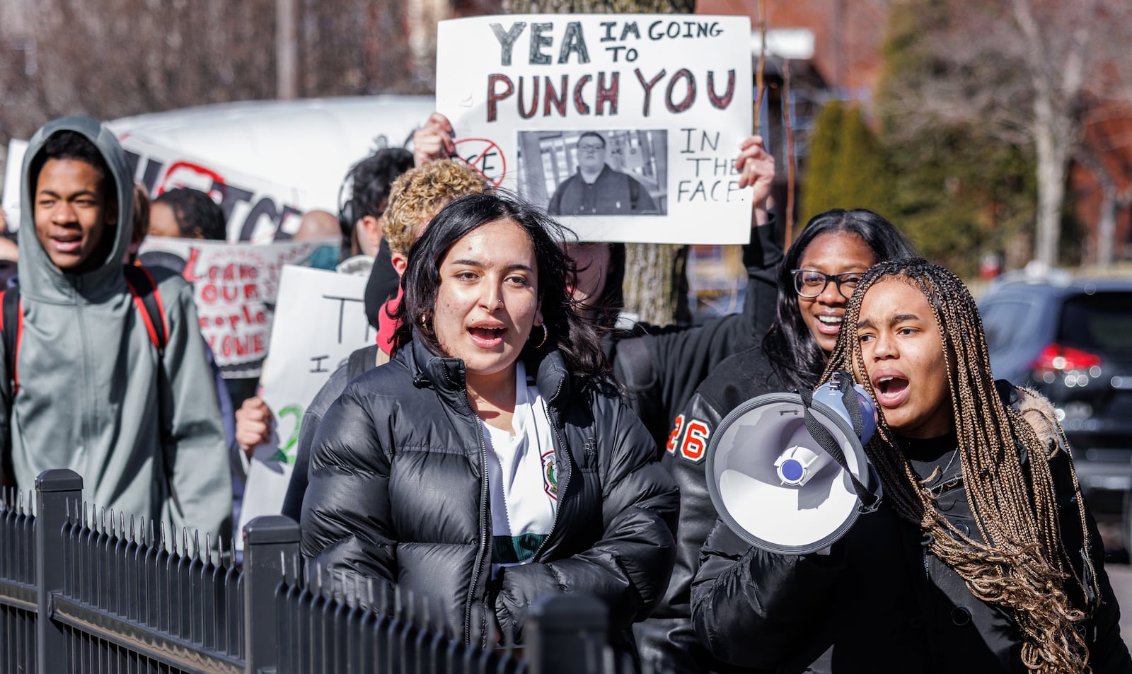 Stivers High School students Chelsea Ruiz (center left) and Dawn Drake (right) lead a group during a protest on Wednesday, Feb. 25 outside the school. Students walked out of their seventh period classes to protest Immigration and Customs Enforcement. BRYANT BILLING / STAFF