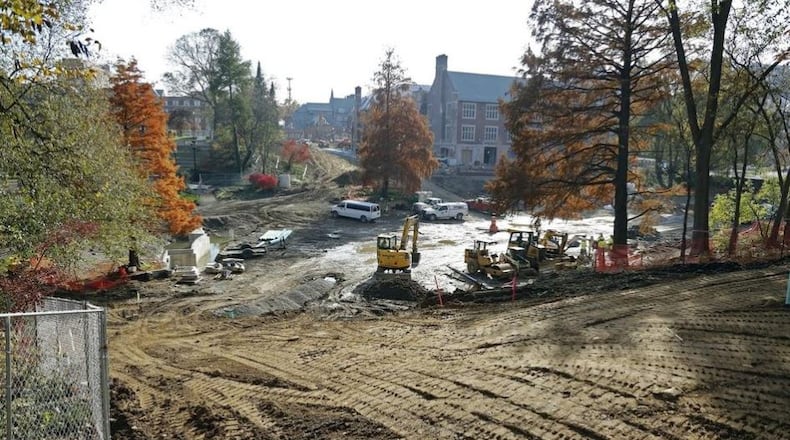 Construction crews have removed the concrete sides and brick bottom of Mirror Lake on the Ohio State University campus. Workers are installing new utilities, and the renovation is expected to be completed in spring. KYLE ROBERTSON/THE COLUMBUS DISPATCH