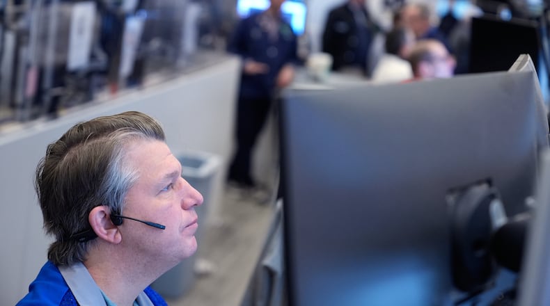 Ed Nangle works on the floor at the New York Stock Exchange in New York, Wednesday, March 4, 2026. (AP Photo/Seth Wenig)