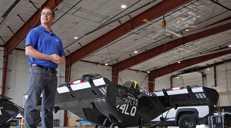 Josh Lane, flight test engineer and site manager, talks about the PIVOTAL Blackfly electric verticle takeoff and landing aircraft Monday, June 17, 2024 at the National Advanced Air Mobility Center of Excellence at Springfield-Beckley Municipal Airport. BILL LACKEY/STAFF