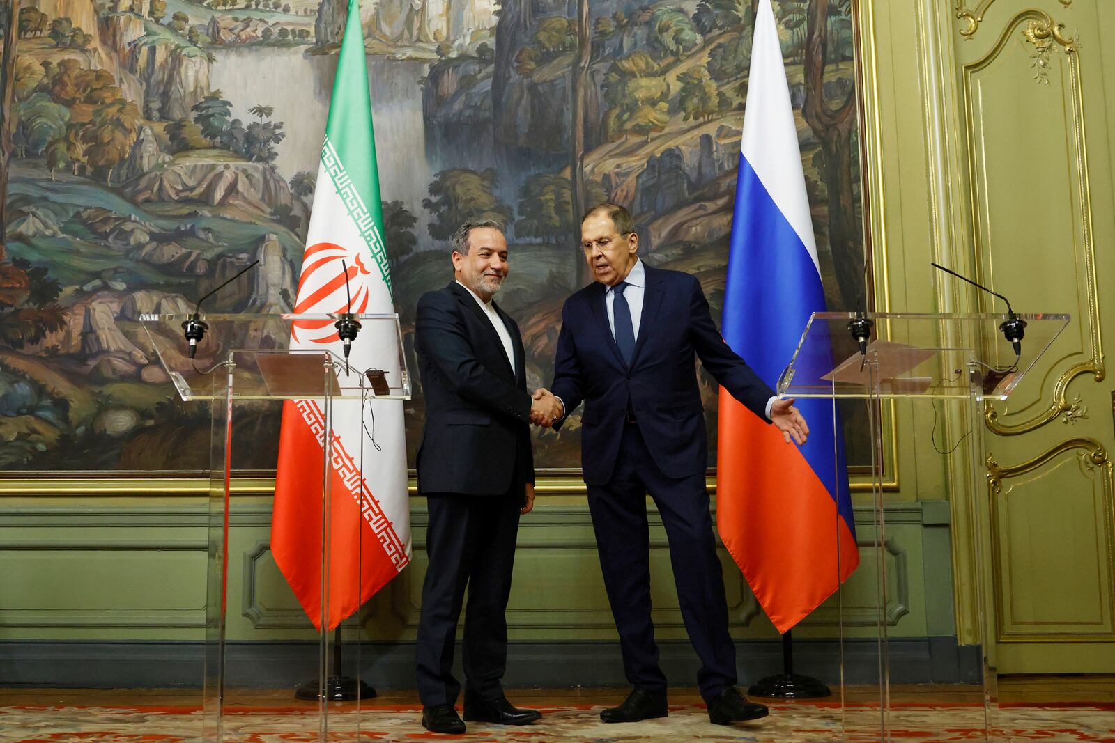 Iranian Foreign Minister Abbas Araghchi, left, and Russian Foreign Minister Sergey Lavrov shake hands after the news conference following their meeting in Moscow, Russia, Friday, April 18, 2025. (Tatyana Makeyeva/Pool Photo via AP)