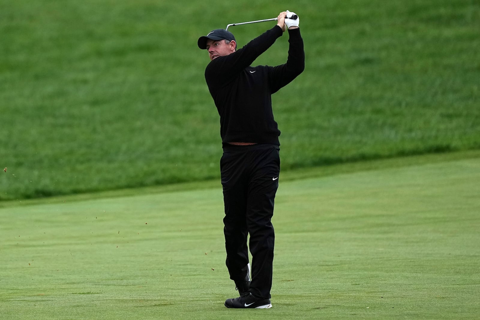 Rory McIlroy, of Northern Ireland, hits on the 13th hole during the second round of the Truist Championship golf tournament at the Philadelphia Cricket Club, Friday, May 9, 2025, in Flourtown. (AP Photo/Matt Rourke)