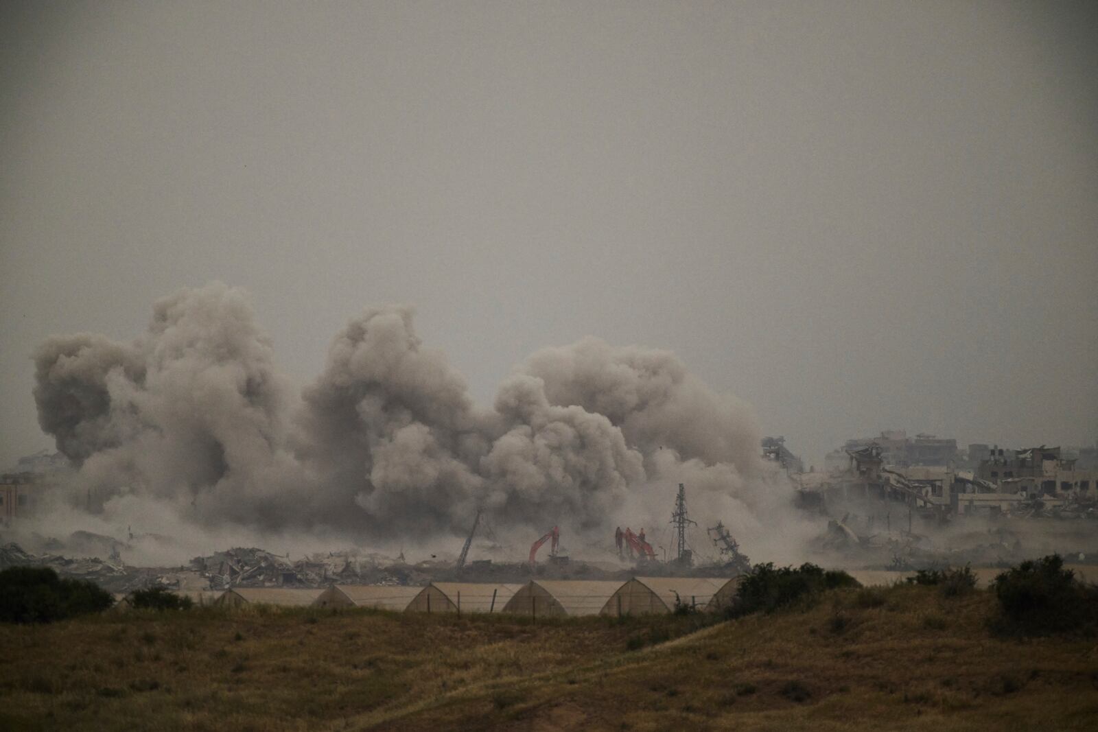 Smoke rises to the sky following an Israeli bombardment in the Gaza Strip as seen from southern Israel, Monday, April 7, 2025. (AP Photo/Leo Correa)