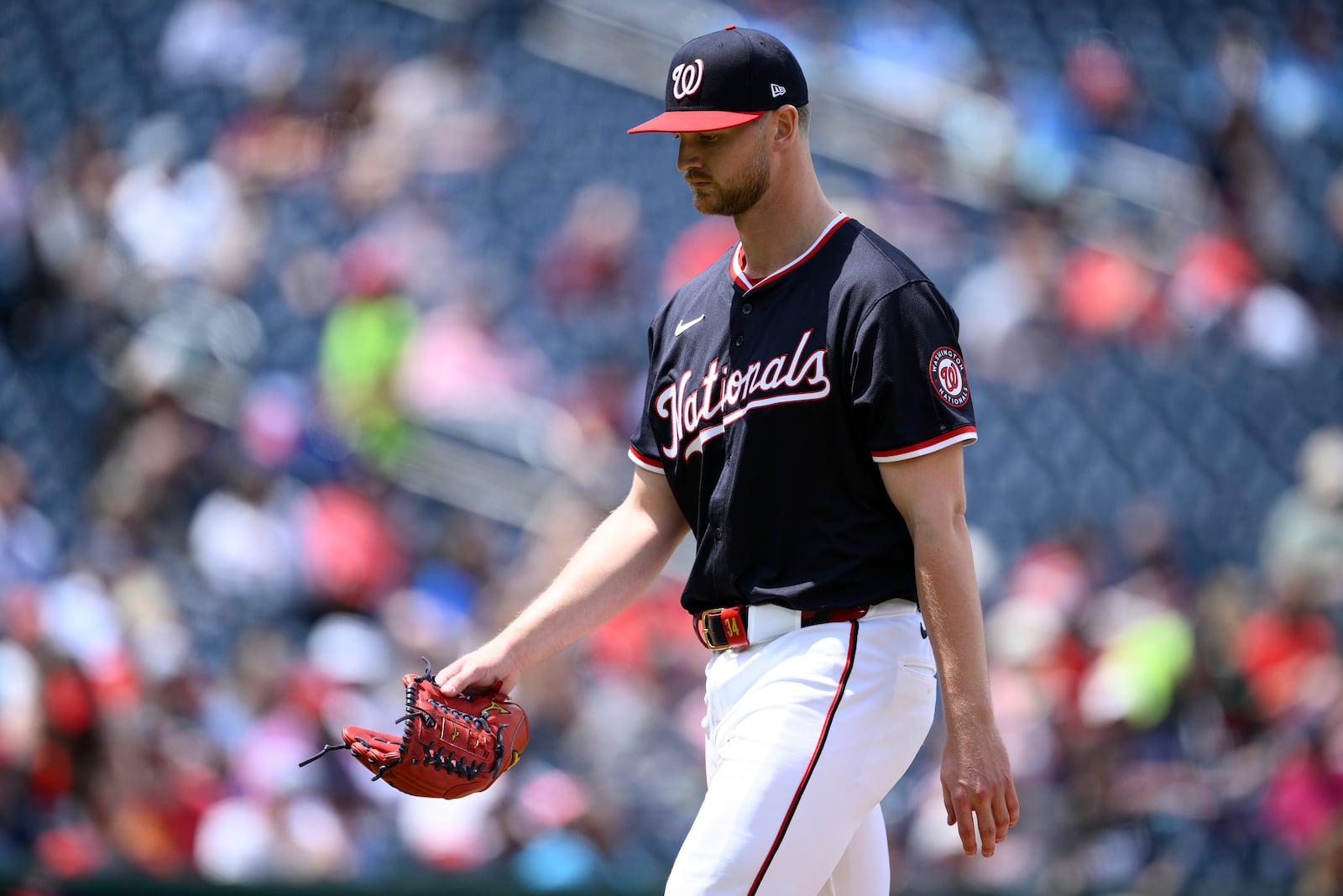 Washington Nationals starting pitcher Michael Soroka walks back to the dugout after he was pulled during the sixth inning of a baseball game against the Cleveland Guardians, Wednesday, May 7, 2025, in Washington. (AP Photo/Nick Wass)
