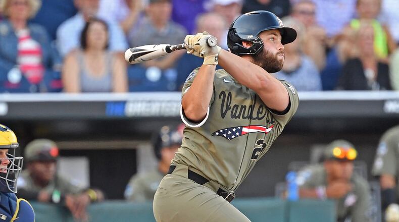 Vanderbilt's Ty Duvall singles in a run in the second inning against the Michigan Wolverines during game one of the College World Series Championship Series on June 24, 2019 at TD Ameritrade Park Omaha in Omaha, Nebraska. (Photo by Peter Aiken/Getty Images)