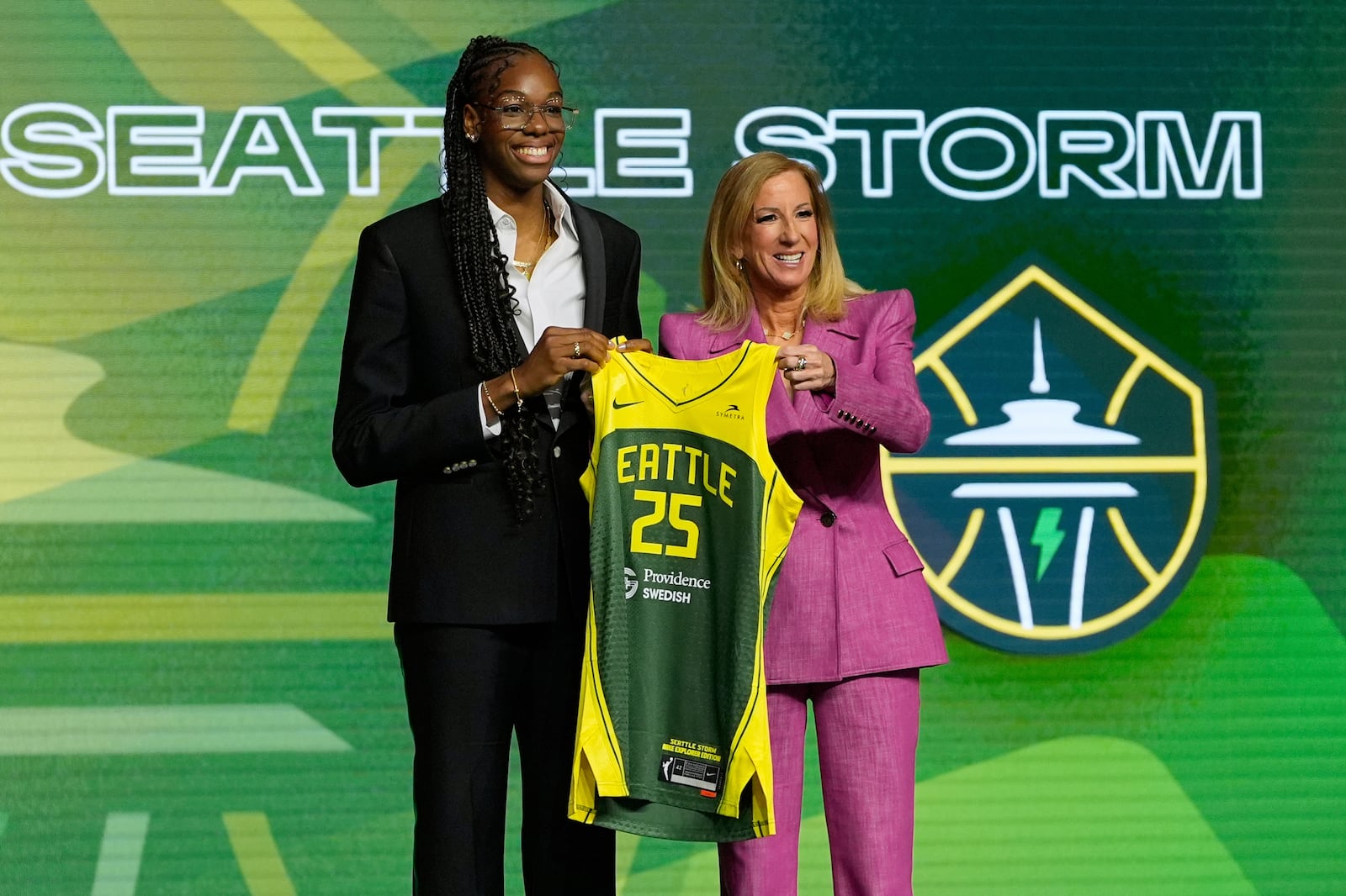 Dominique Malonga, left, poses with WNBA commissioner Cathy Engelbert after being selected second overall by the Seattle Storm during the first round of the WNBA basketball draft, Monday, April 14, 2025, in New York. (AP Photo/Pamela Smith)