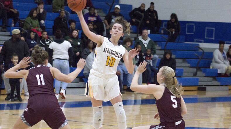 Springfield sophomore guard Mickayla Perdue passes over one of the many double-teams she faced Saturday in a 46-41 loss at home to Lebanon. Perdue scored 11 points. Jeff Gilbert/CONTRIBUTED