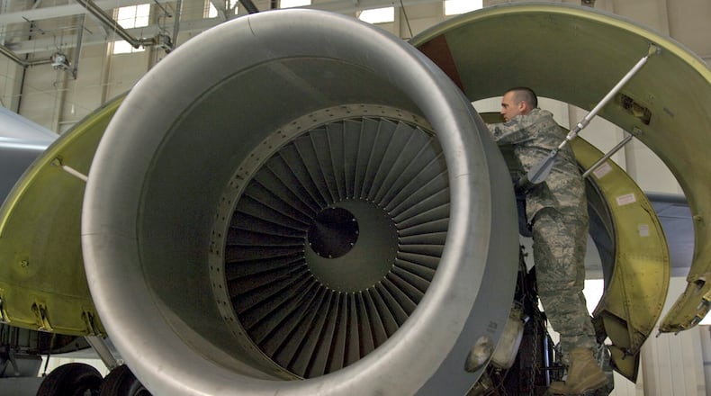 Tech. Sgt. Stefan Sianis inspects a KC-135R Stratotanker F108-100 engine before its lowered from the aircraft March 3, 2010, at McConnell Air Force Base, Kan. Sergeant Sianis is a mechanic assigned to the 22nd Aircraft Maintenance Squadron. (U.S. Air Force photo/Senior Airman Abigail Klein)