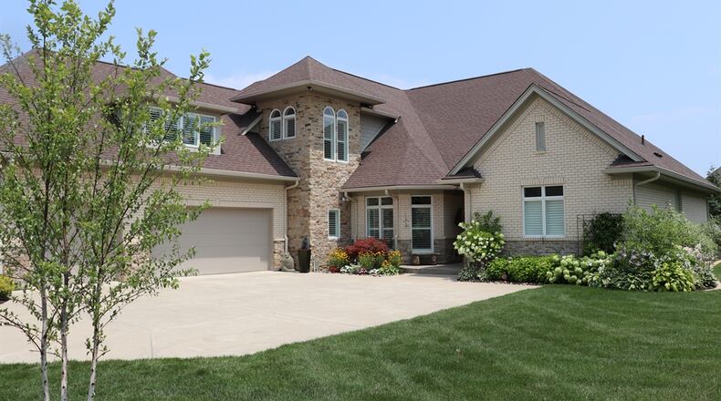 Listed for $975,000 by Coldwell Banker Heritage, the brick two-story home at 9410 Old Bridge Drive has about 5,117 square feet of living space. Contributed photos by Kathy Tyler