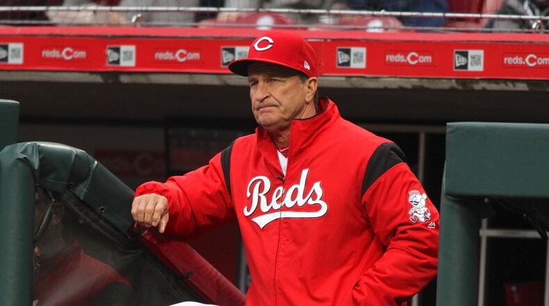 Reds interim manager Jim Riggleman watches the action during a game against the Braves on Monday, April 23, 2018, at Great American Ball Park in Cincinnati. David Jablonski/Staff