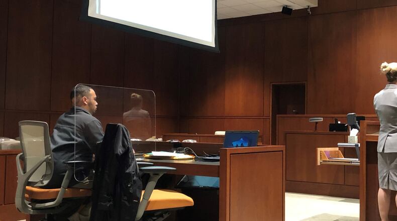Corrections Officer Ari Combs, accused of sexual battery on an inmate at Warren Corrrectional Institution last September, listens Monday during a suppression hearing in Warren County Common Pleas Court. STAFF/LAWRENCE BUDD
