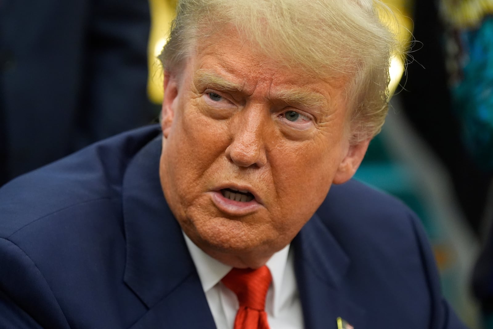 President Donald Trump answers questions from reporters as he meets with Congo's Foreign Minister Therese Kayikwamba Wagner, and Rwanda's Foreign Minister Olivier Nduhungirehe, Friday, June 27, 2025, in the Oval Office at the White House in Washington. (AP Photo/Manuel Balce Ceneta)