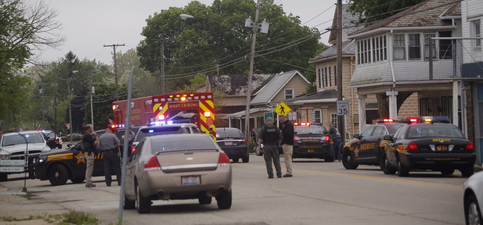 Emergency personnel arrive to the scene of a shooting outside Pine Kirk nursing home in Kirkersville, Ohio on Friday, May 12, 2017. Authorities say Steven Eric Disario, who headed the Kirkersville Police Department, and two nursing home employees have been killed by a gunman who was later found dead inside the care facility. (Tom Dodge/The Columbus Dispatch via AP)