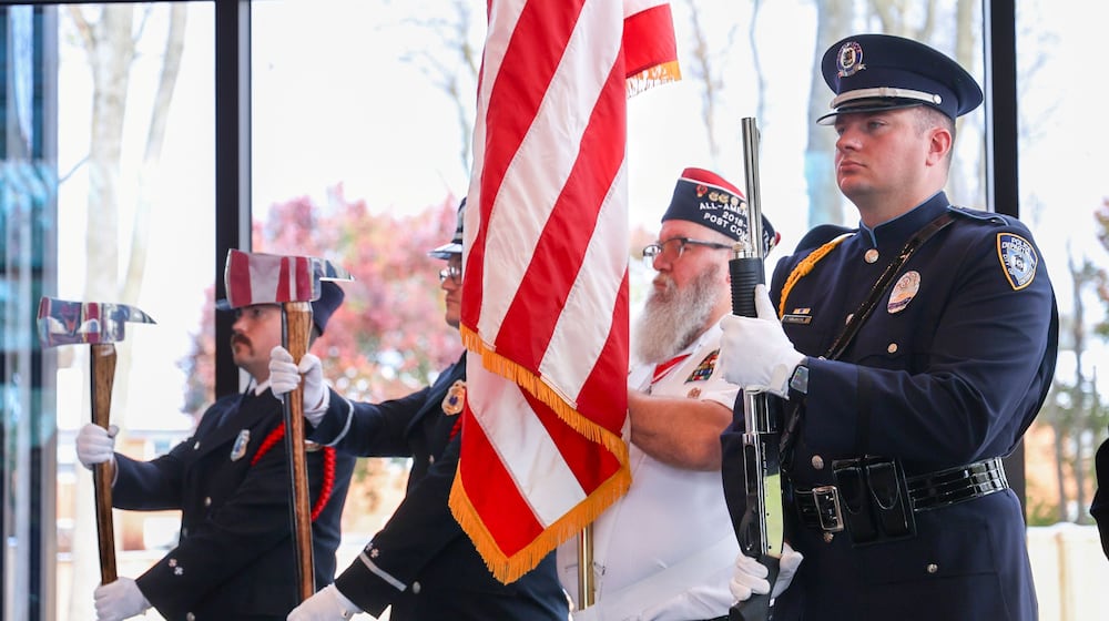 Centerville Police Department's honor guard stands during the national anthem during a Veterans Day event on Tuesday, Nov. 11 at Benham's Grove in Centerville.