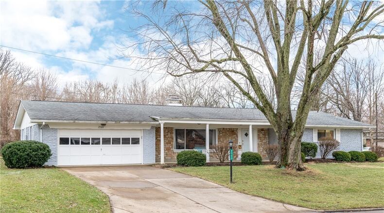 The four bedroom, two and a half bathroom ranch has a two car attached garage and covered front porch.