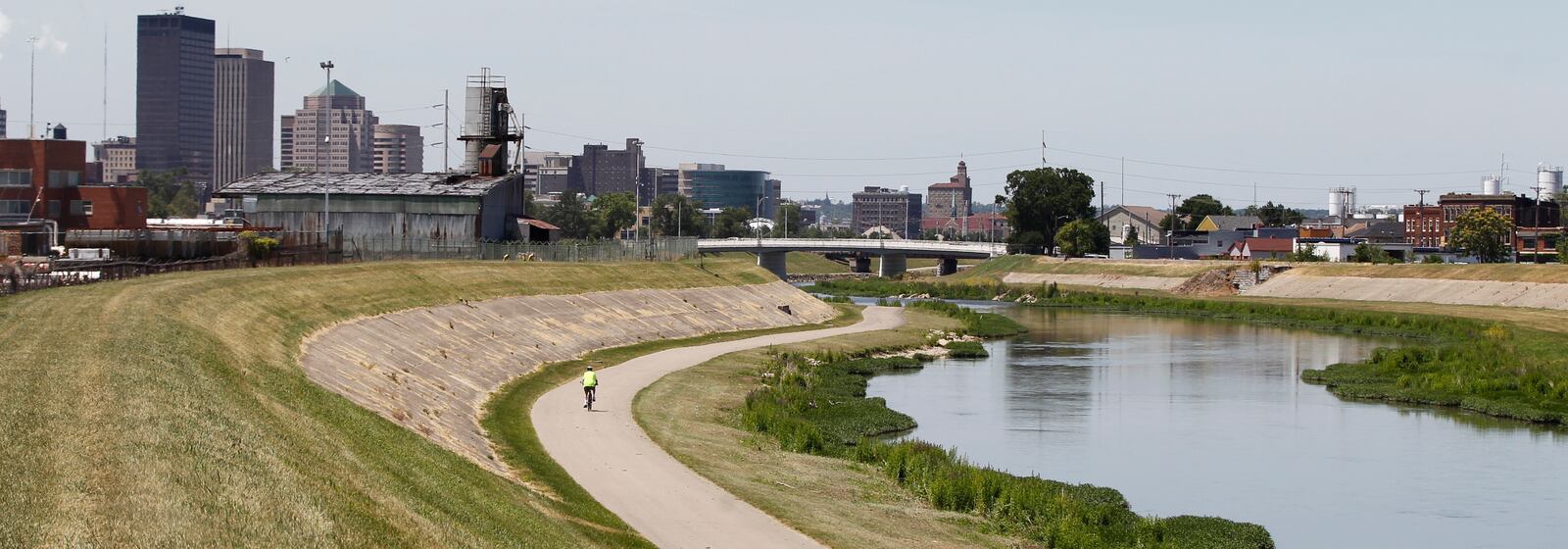 A runner exercises during the lunch-hour on the Mad River Trail that runs from the Great Miami River to Eastwood park and is part of the Miami Valley Bike Trails network that includes more than 300 miles of trail to explore.--Staff Photo by Ty Greenlees