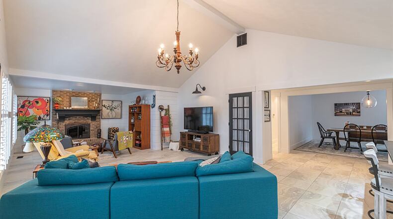 The dining room is off the great room as is a cozy sitting room, adding to the open space.