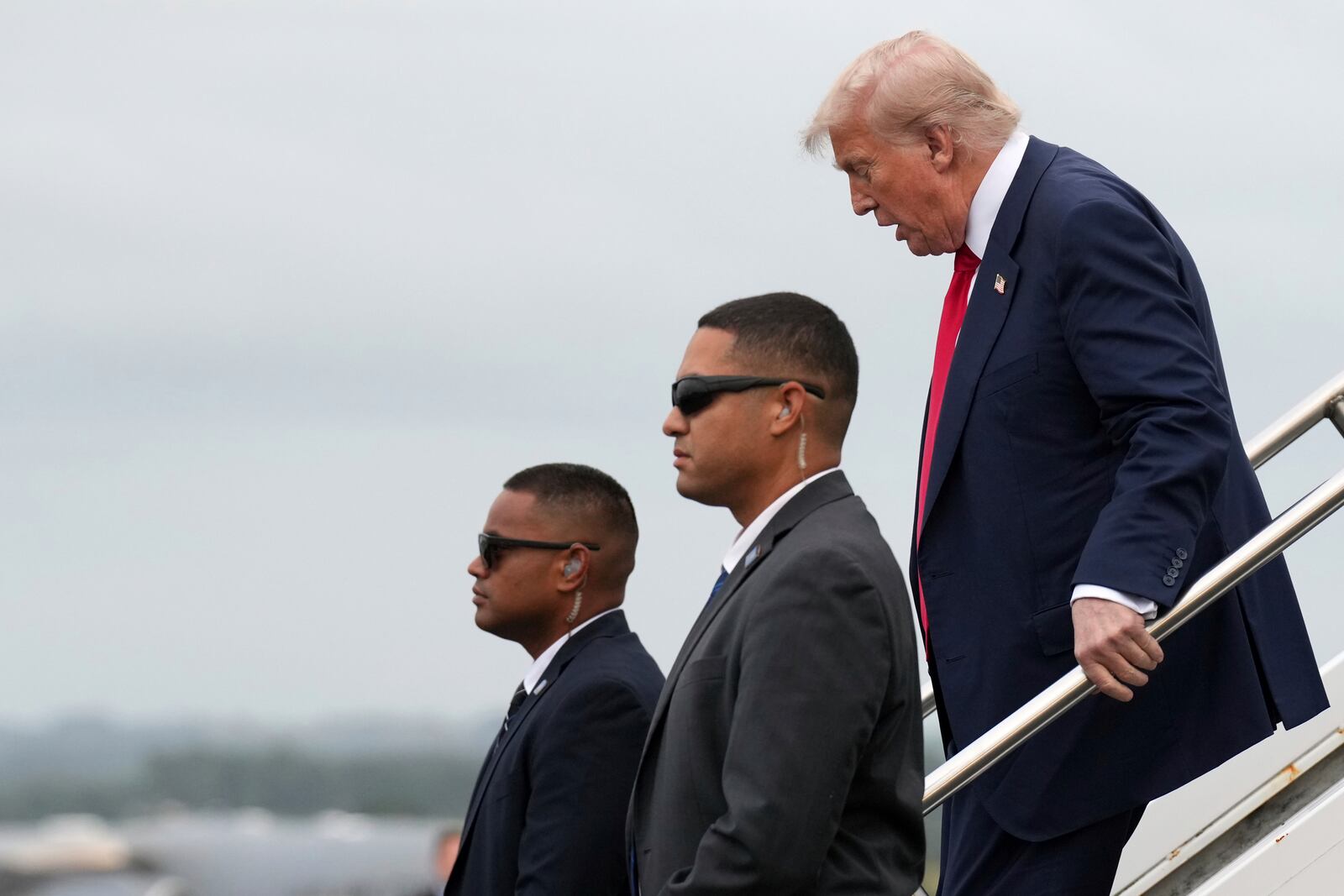 President Donald Trump disembarks from Air Force One as he arrives at Prestwick Airport in Ayrshire, Scotland, Friday, July 25, 2025.(AP Photo/Jacquelyn Martin)