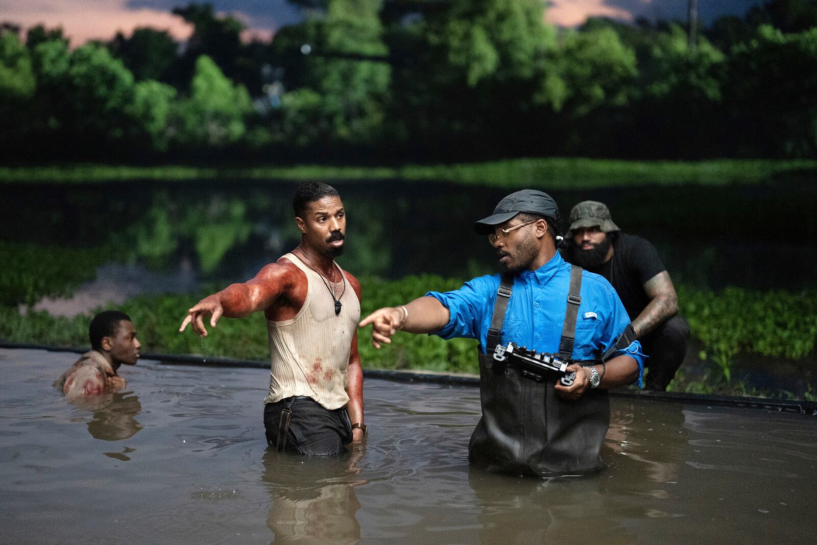 This image released by Warner Bros. Pictures shows actor Michael B. Jordan, left, and director-writer-producer Ryan Coogler on the set of "Sinners." (Eli Adé/Warner Bros. Pictures via AP)