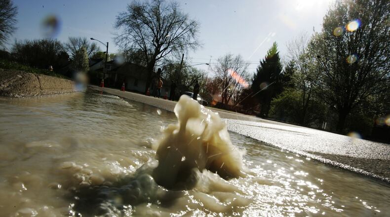 A large water main brake Wednesday April 13 pushes water through South Blvd. in Kettering between Rushland and Ansel Drives. South Blvd. is closed between Rushland and Ansel. JIM NOELKER/STAFF