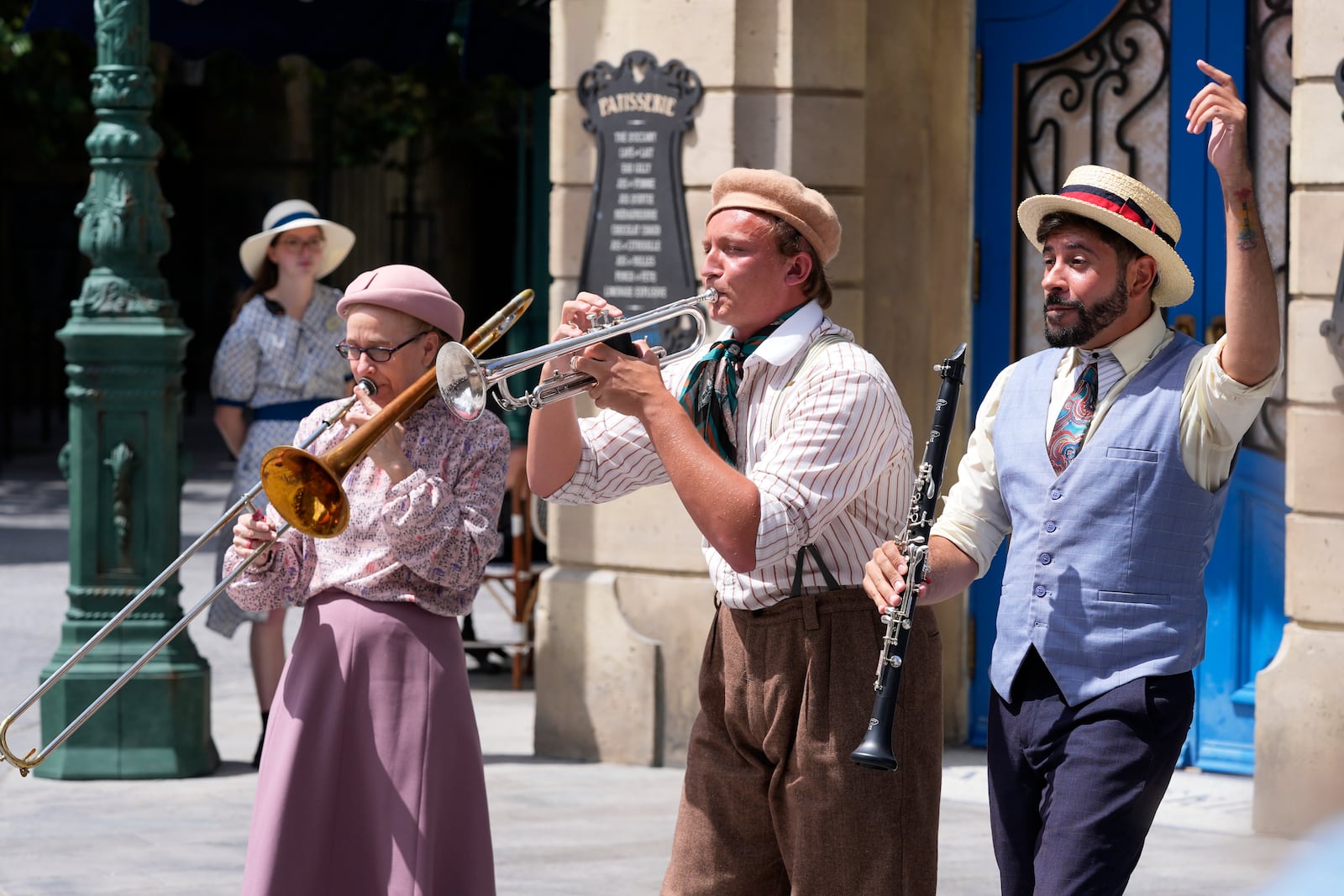 Street musicians perform for guests at The Wizarding World of Harry Potter, Ministry of Magic at Epic Universe at Universal Resort Orlando Thursday, April 10, 2025, in Orlando, Fla. (AP Photo/John Raoux)